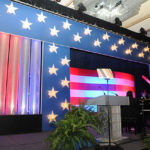 A stage decorated with the US flag colors